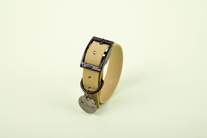 A tan dog waterproof collar with a black buckle.